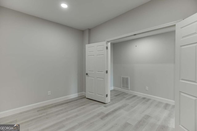 7208 Whitewater Dr, Flowery Branch, GA 30542 - unfurnished bedroom with light wood-style floors and recessed lighting