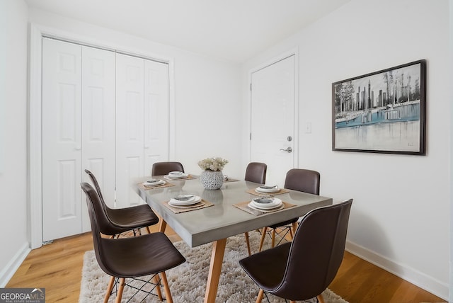 2215 Gordon Cir SE, Smyrna, GA 30080 - dining room featuring light wood-style floors and baseboards