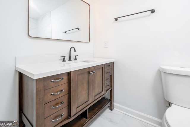 2215 Gordon Cir SE, Smyrna, GA 30080 - half bath featuring baseboards, marble finish floor, vanity, and toilet
