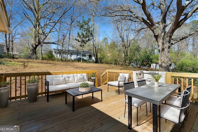 2215 Gordon Cir SE, Smyrna, GA 30080 - deck with an outdoor living space, outdoor dining space, and a playground