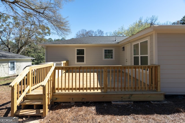 2215 Gordon Cir SE, Smyrna, GA 30080 - rear view of house featuring a wooden deck and roof with shingles