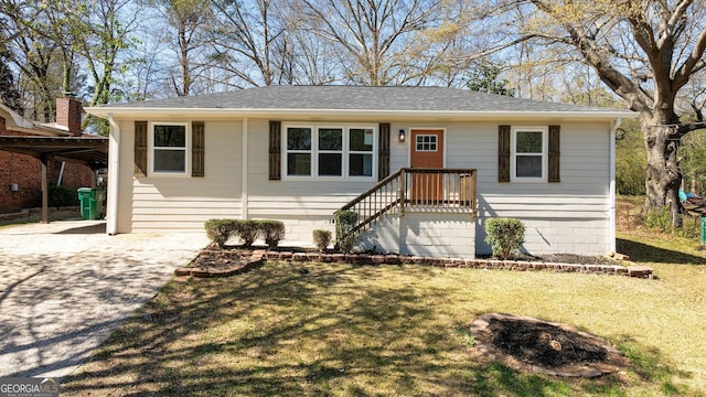 2215 Gordon Cir SE, Smyrna, GA 30080 - ranch-style house with concrete driveway, roof with shingles, and a front yard