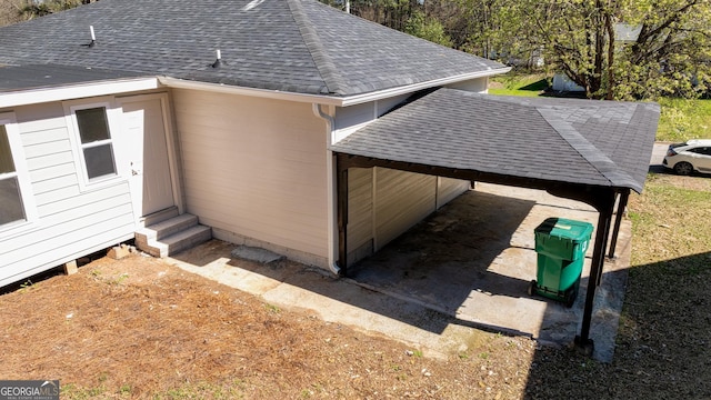 2215 Gordon Cir SE, Smyrna, GA 30080 - view of side of property with entry steps, roof with shingles, and a carport