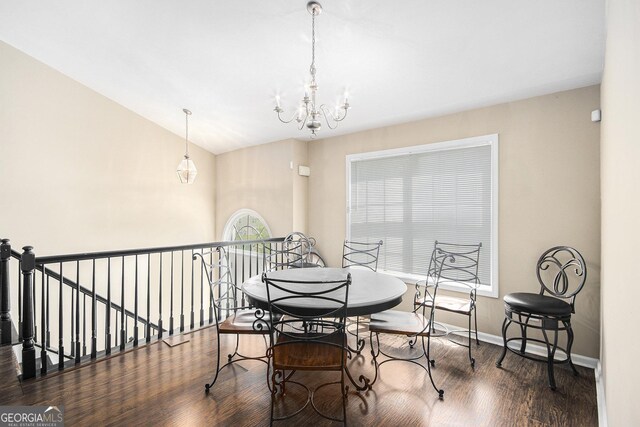 280 Brookview Dr, Dallas, GA 30132 - dining area featuring baseboards, vaulted ceiling, wood finished floors, and a notable chandelier