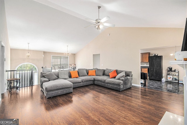 280 Brookview Dr, Dallas, GA 30132 - living area with dark wood finished floors, high vaulted ceiling, and ceiling fan with notable chandelier