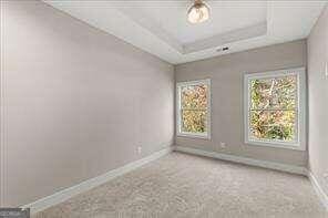 unfurnished room featuring baseboards