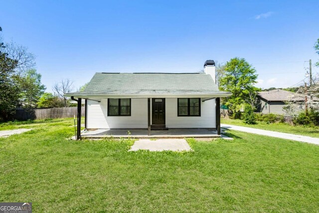 3556 Finch Rd SW, Powder Springs, GA 30127 - bungalow-style house with covered porch and a chimney