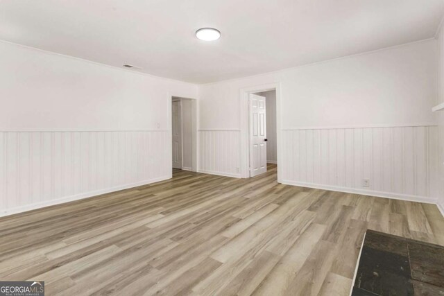 3556 Finch Rd SW, Powder Springs, GA 30127 - empty room with wood finished floors and wainscoting
