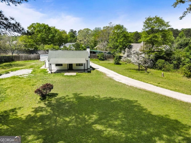 3556 Finch Rd SW, Powder Springs, GA 30127 - view of front of house featuring dirt driveway, a chimney, and view of wooded area