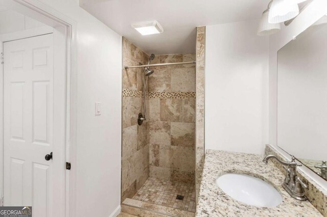 3556 Finch Rd SW, Powder Springs, GA 30127 - full bathroom with a tile shower and vanity