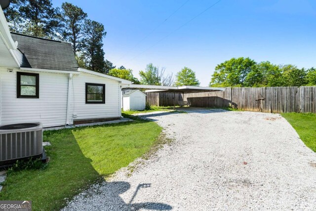 3556 Finch Rd SW, Powder Springs, GA 30127 - view of yard with central AC unit and gravel driveway
