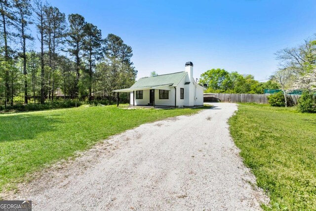 3556 Finch Rd SW, Powder Springs, GA 30127 - view of front of house featuring dirt driveway and a chimney