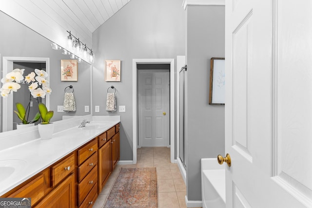 bathroom with vaulted ceiling, a sink, double vanity, an enclosed shower, and tile patterned flooring