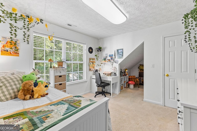 bedroom featuring a textured ceiling, baseboards, visible vents, and light colored carpet