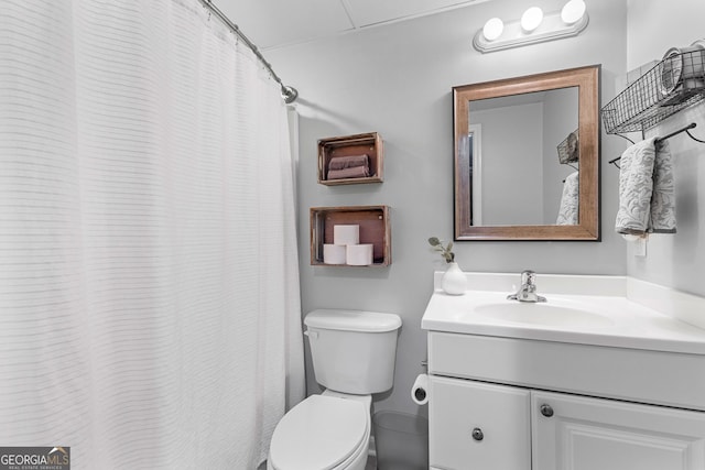 bathroom featuring toilet and vanity
