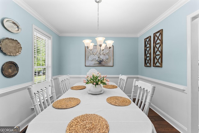 dining room with baseboards, crown molding, dark wood-style floors, and a notable chandelier
