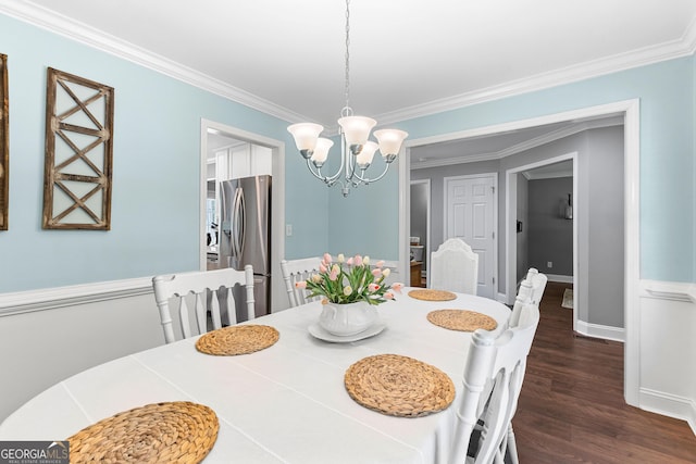 dining area featuring baseboards, dark wood-style flooring, a chandelier, and crown molding