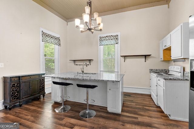 kitchen featuring white electric range oven, a sink, an inviting chandelier, dark wood-style flooring, and light stone countertops