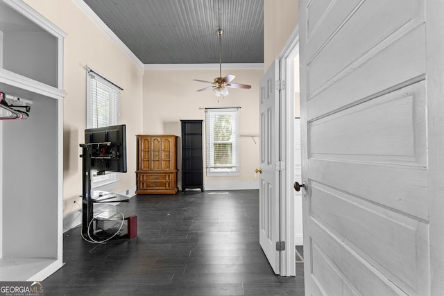 hall featuring wood ceiling, plenty of natural light, dark wood-type flooring, and crown molding