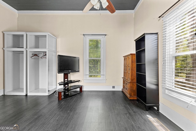 living area with dark wood finished floors, baseboards, a ceiling fan, and visible vents
