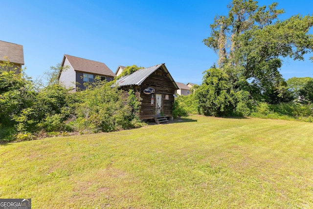view of yard with an outbuilding and entry steps