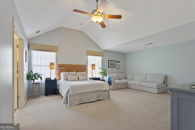 bedroom featuring visible vents, a ceiling fan, high vaulted ceiling, and light colored carpet