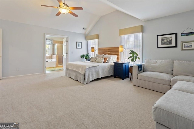 bedroom featuring visible vents, light carpet, high vaulted ceiling, connected bathroom, and a ceiling fan