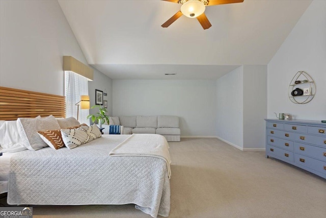 carpeted bedroom with baseboards, ceiling fan, and lofted ceiling