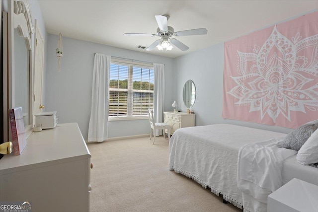 bedroom featuring a ceiling fan, baseboards, light colored carpet, and visible vents