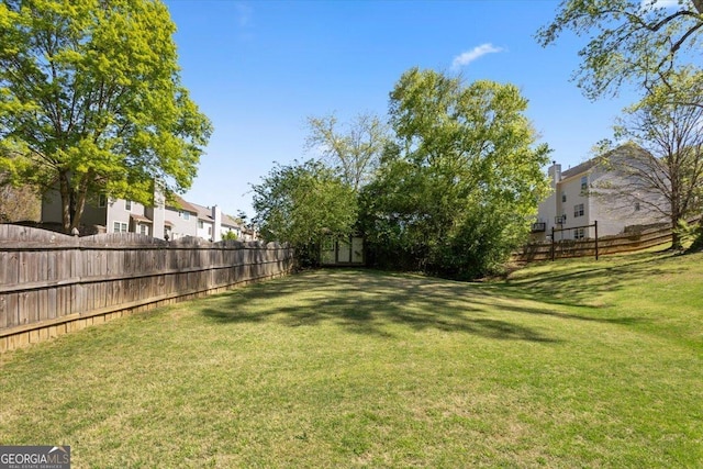 view of yard featuring a fenced backyard
