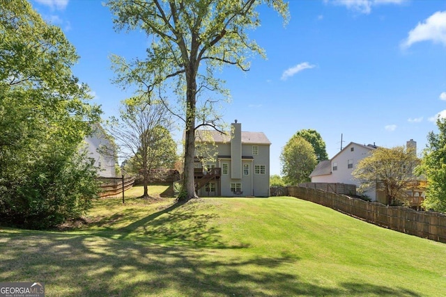 view of yard with a fenced backyard