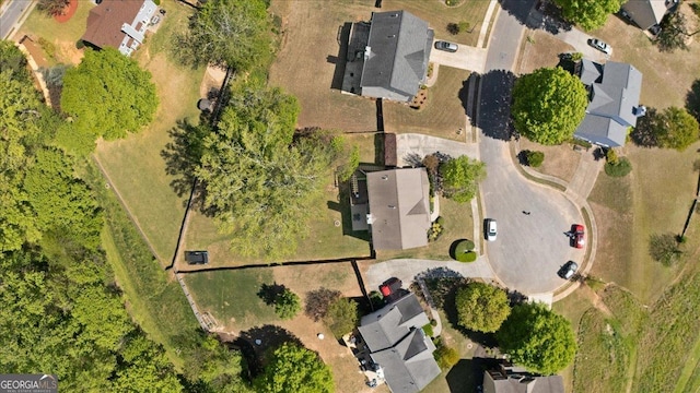 birds eye view of property with a residential view