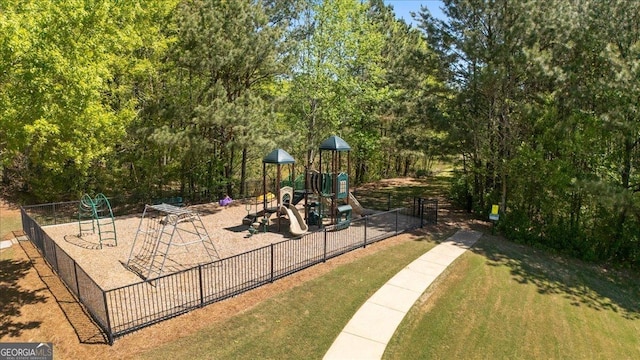 community playground with fence and a yard