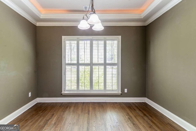 100 Hickory Dr, Stockbridge, GA 30281 - unfurnished room featuring crown molding, wood finished floors, an inviting chandelier, a raised ceiling, and baseboards