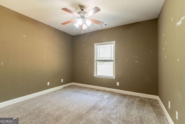100 Hickory Dr, Stockbridge, GA 30281 - unfurnished room featuring baseboards, visible vents, carpet, and ceiling fan
