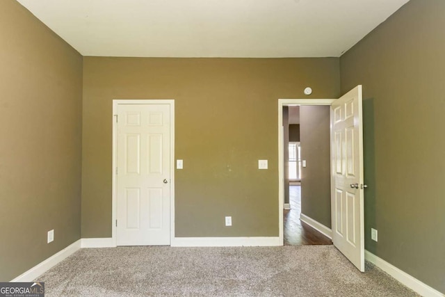 100 Hickory Dr, Stockbridge, GA 30281 - unfurnished bedroom featuring baseboards and carpet