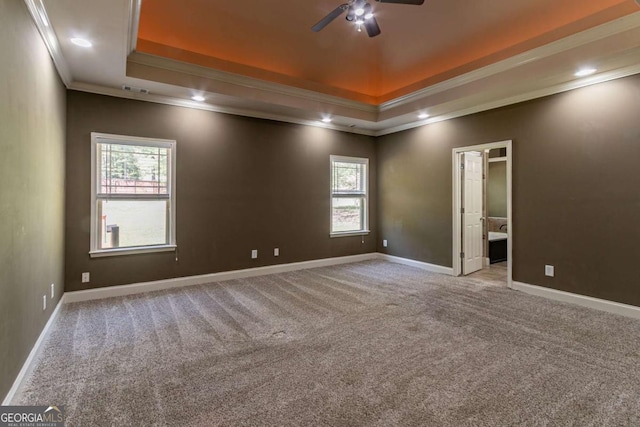 100 Hickory Dr, Stockbridge, GA 30281 - spare room featuring a ceiling fan, ornamental molding, a tray ceiling, and plenty of natural light