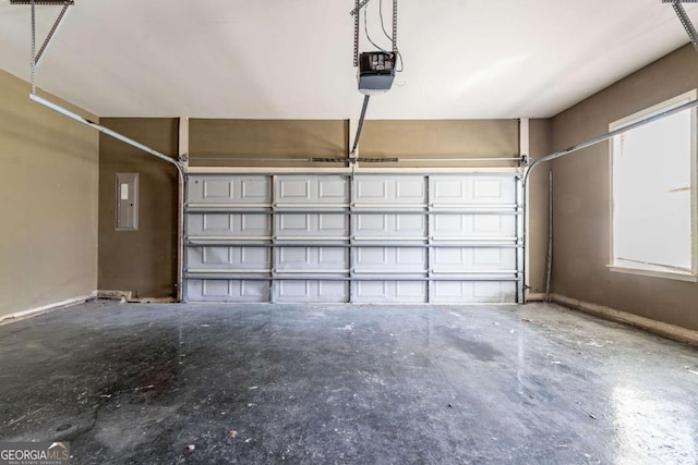 100 Hickory Dr, Stockbridge, GA 30281 - garage with electric panel, baseboards, and a garage door opener