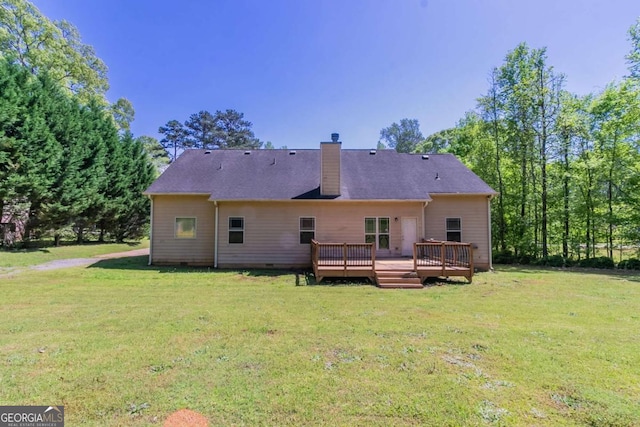 100 Hickory Dr, Stockbridge, GA 30281 - back of house with a wooden deck, a yard, crawl space, and a chimney