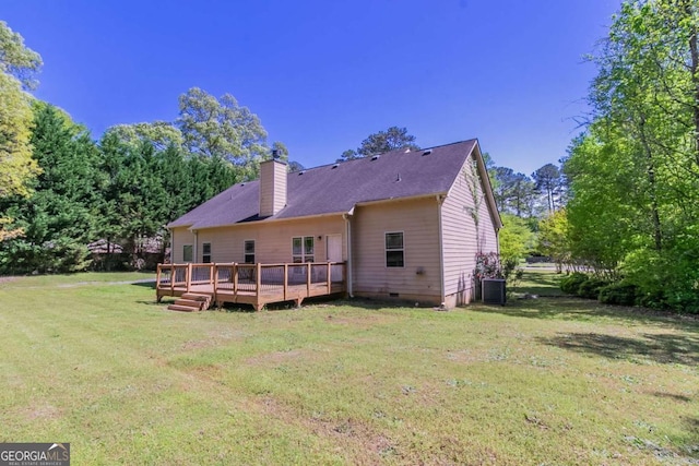 100 Hickory Dr, Stockbridge, GA 30281 - back of house featuring crawl space, a lawn, a chimney, a deck, and cooling unit
