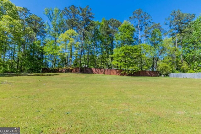100 Hickory Dr, Stockbridge, GA 30281 - view of yard featuring fence