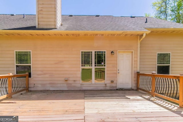 100 Hickory Dr, Stockbridge, GA 30281 - back of property with roof with shingles, a chimney, and a deck