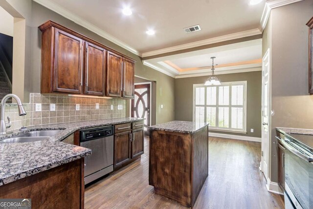 100 Hickory Dr, Stockbridge, GA 30281 - kitchen with light stone counters, wood finished floors, a sink, appliances with stainless steel finishes, and visible vents
