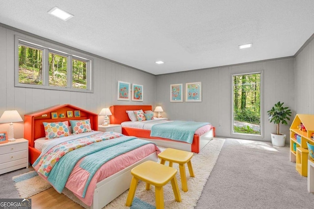 bedroom featuring carpet and a textured ceiling
