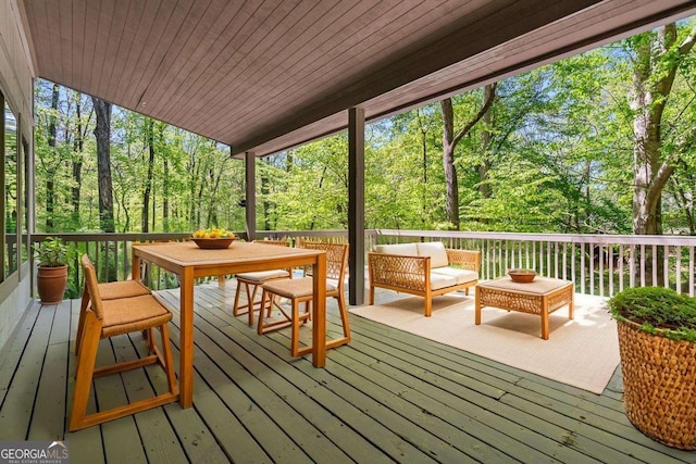 wooden deck featuring outdoor lounge area