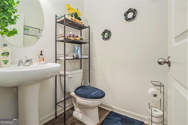 129 Coldwater Way, Griffin, GA 30224 - bathroom featuring a sink, baseboards, toilet, and wood finished floors