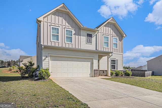 129 Coldwater Way, Griffin, GA 30224 - view of front of house with board and batten siding, an attached garage, and driveway