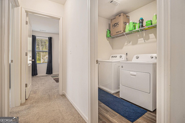 129 Coldwater Way, Griffin, GA 30224 - clothes washing area with laundry area, light colored carpet, visible vents, baseboards, and separate washer and dryer