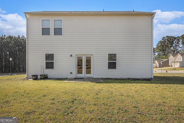 129 Coldwater Way, Griffin, GA 30224 - rear view of property with a yard