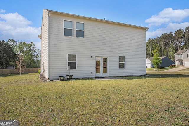 129 Coldwater Way, Griffin, GA 30224 - rear view of house with a yard, fence, and french doors